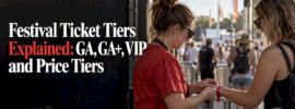 Staff fastening a festival access wristband